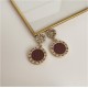 Striking Gold Drop Earrings with Roman Numerals image